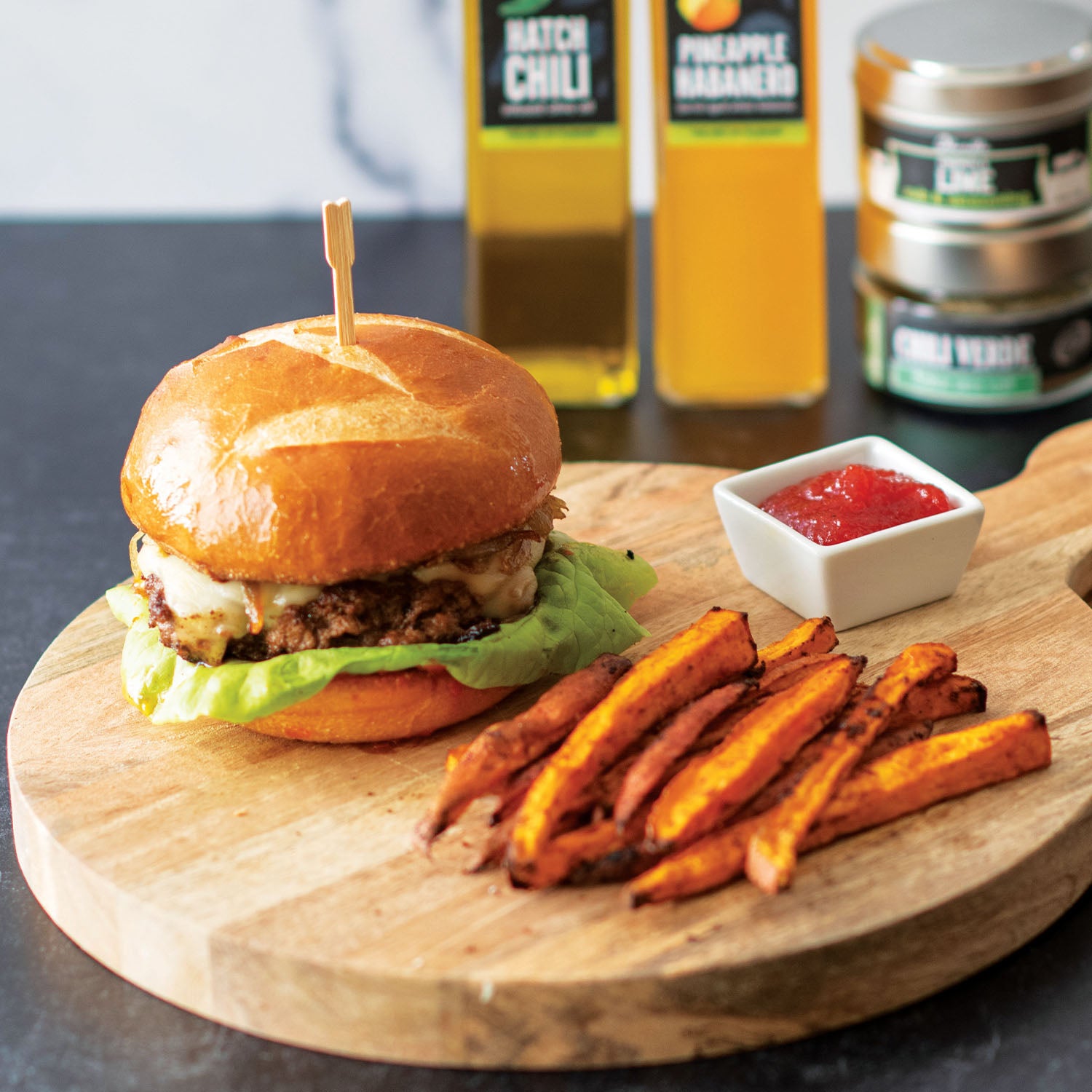 Green Chile Burger with Red Pepper Jam and Caramelized Onions with Chili Lime Sweet Potato Fries