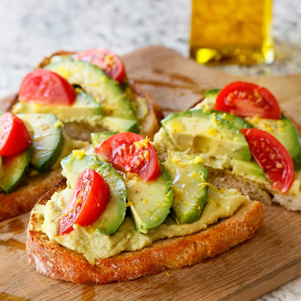 Crispy bread topped with smashed avocados, sliced avocado, fresh tomatoes, sea salt and a drizzle of our Sicilian Lemon Olive Oil and new Sriracha Balsamic vinegar for an amazing mix of sweet, spicy, salty and tangy. 