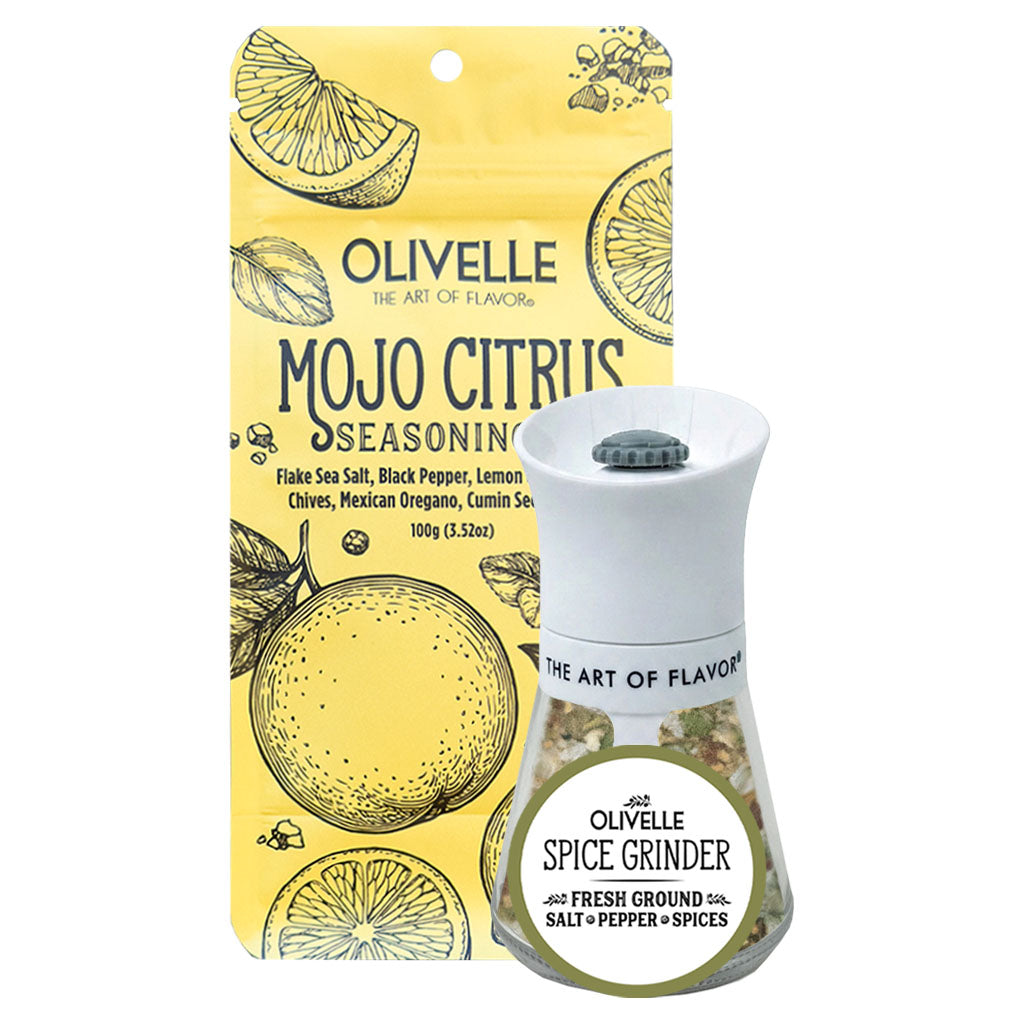 Olivelle Mojo Citrus Seasoning set featuring a yellow illustrated hanging packet and a white-and-clear spice grinder with a green lid, on a plain white background.