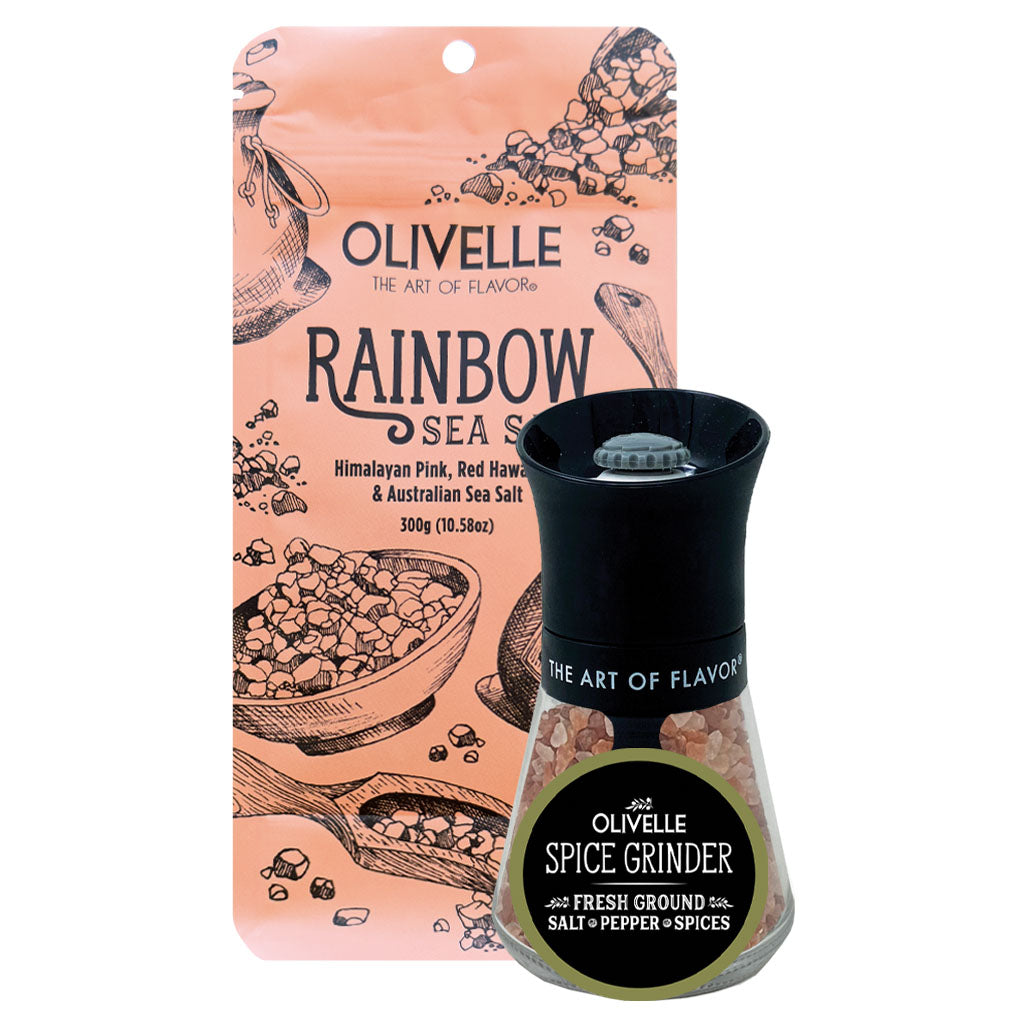 Olivelle Rainbow Sea Salt spice grinder set, featuring a 300g pouch of Himalayan pink, red, brown, and Australian sea salt next to a black pepper mill grinder with a clear glass base showing the salt inside.