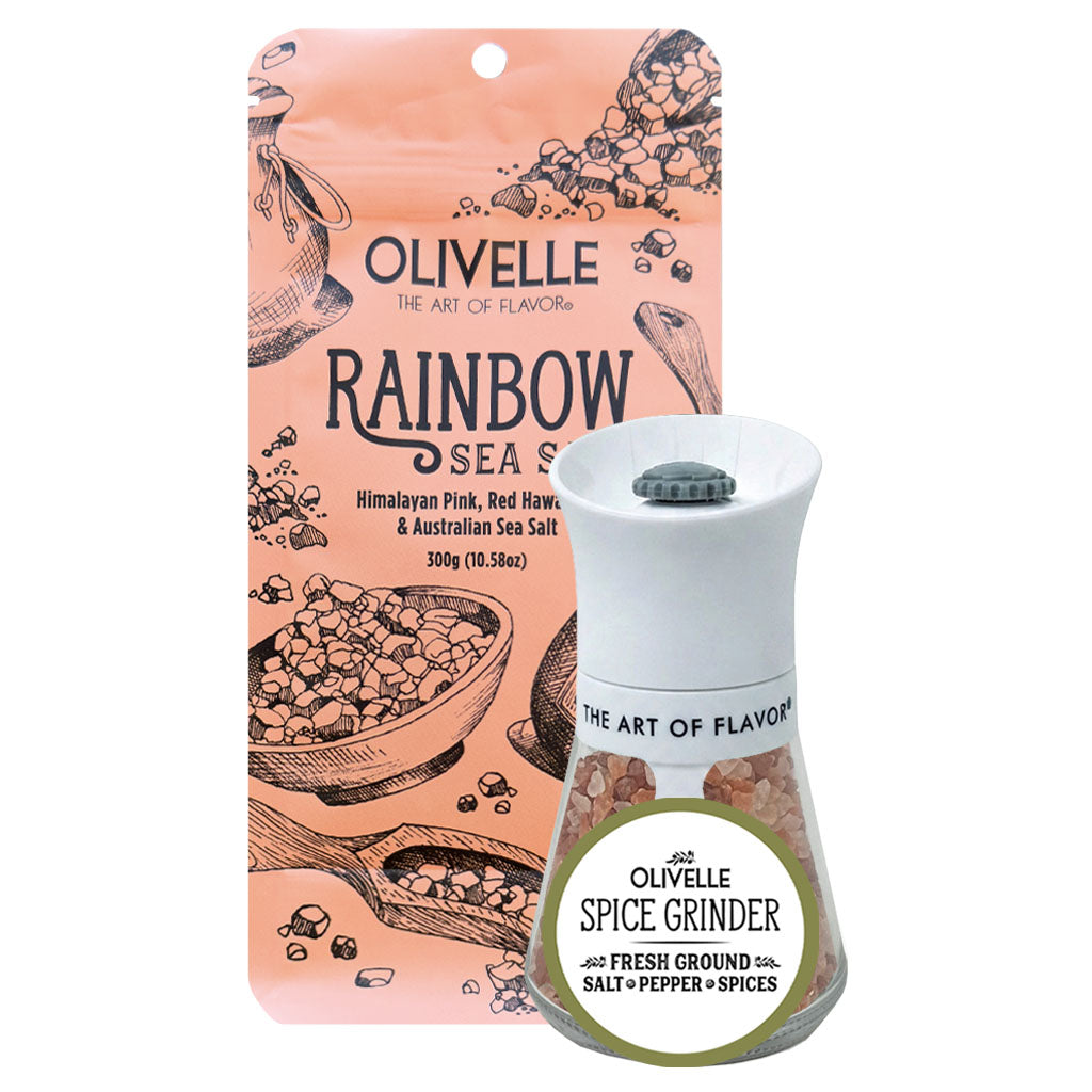 Olivelle Rainbow Sea Salt spice grinder shown with its peach-colored illustrated packaging card and the grinder itself on a plain white background.